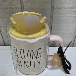 Rae Dunn Sleeping Beauty Mug with Pink Handle and Yellow Lid